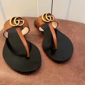Gucci saddle brown marmot slide sandals.  Only wore one time.